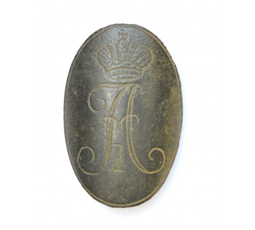 variant of a decorative shield that was attached to pistol bearning the monogramm of  Emperor Alexander I of Russia